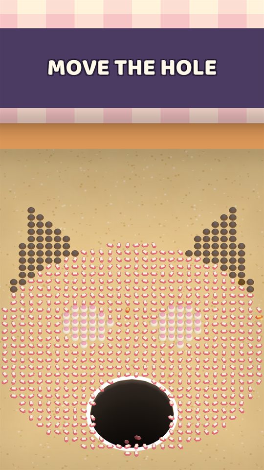 The hole starting small on a board of sprinkles laid out as a cat